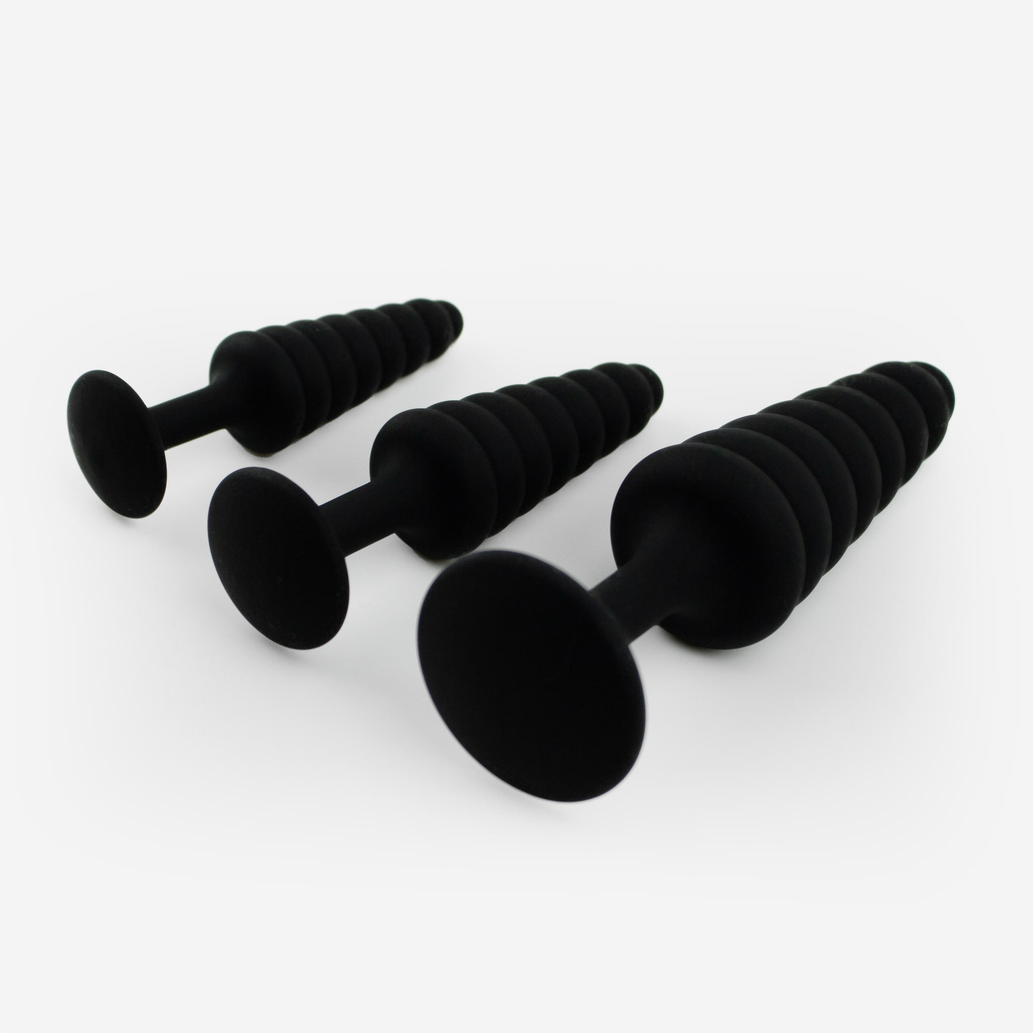 Unilove Basics butt plug sæt 3 stk liggende